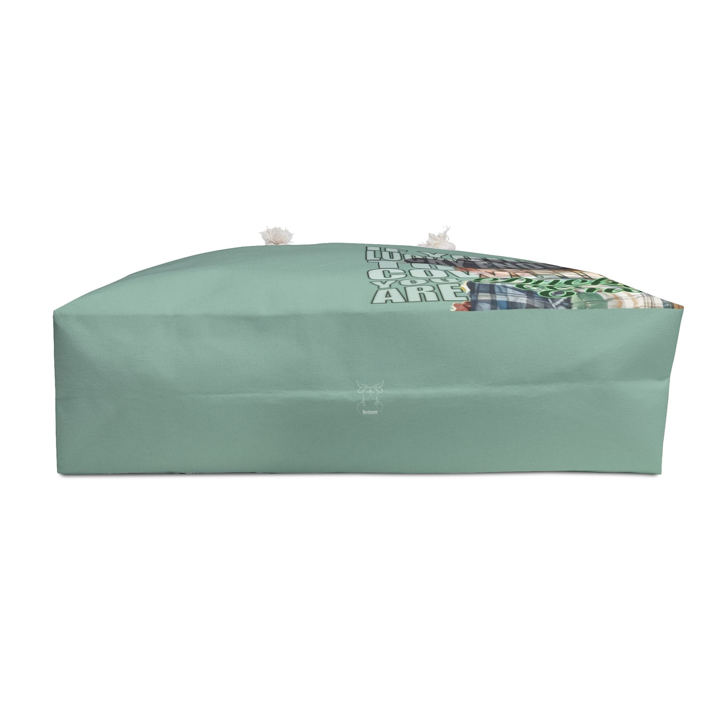 Pretty mint green weekender bag is imprinted both sides with ou exclusive Lucky Enough image of a blond, laughing, and happy cowgirl in a plaid shirt on the right side. Bag features white rope handles and sheeting lining.