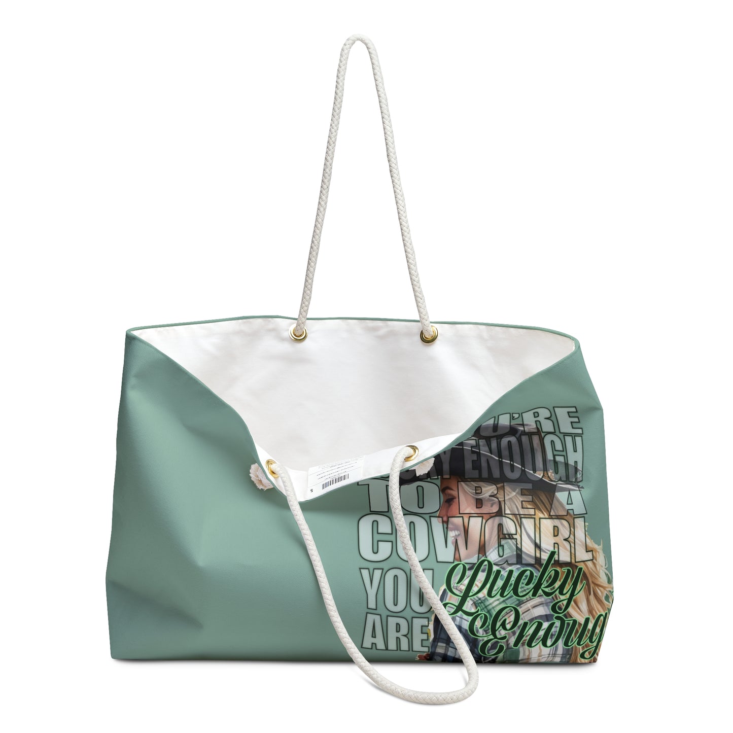 Pretty mint green weekender bag is imprinted both sides with ou exclusive Lucky Enough image of a blond, laughing, and happy cowgirl in a plaid shirt on the right side. Bag features white rope handles and sheeting lining.