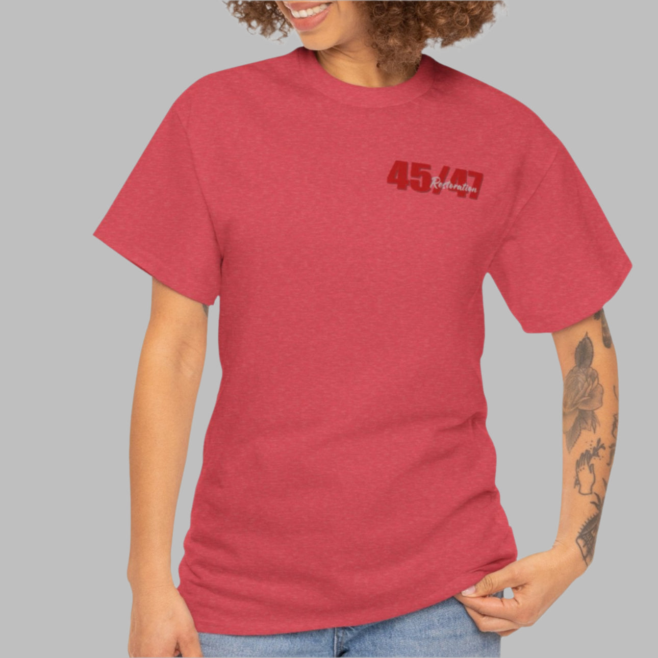 Cotton t-shirt imprinted in red with a gray overprint on the back of the names and strongest qualities of President Trump and his cabinet members / nominees. The front is imprinted on the left chest with 45/47 and the word Restoration overprinted in gray.