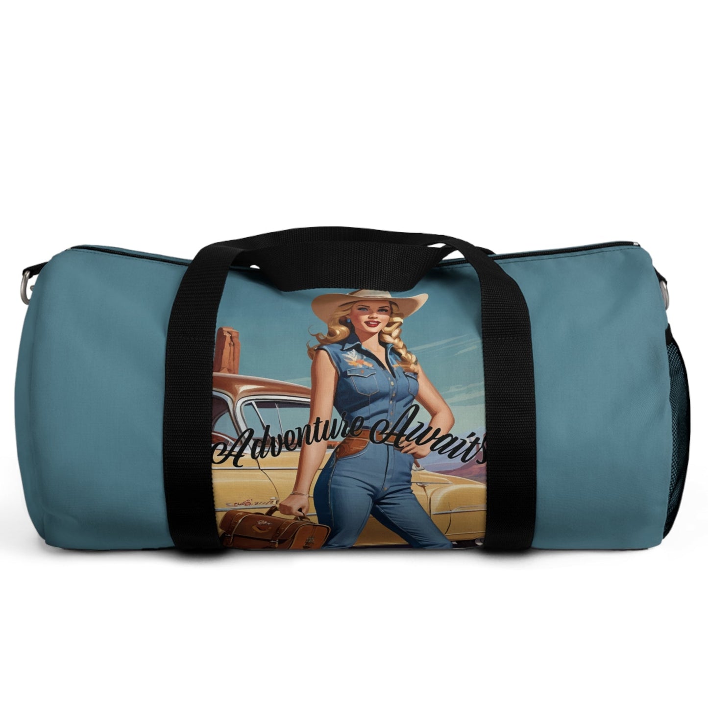 SMALL. Robin egg blue duffel bag with colorful retro cowgirl ready to roll through the SW United States. She's got her favorite bag and her trusty vintage sedan. Bag features black handles and a removable shoulder strap as well as a mesh exterior pocket. Available in two sizes.