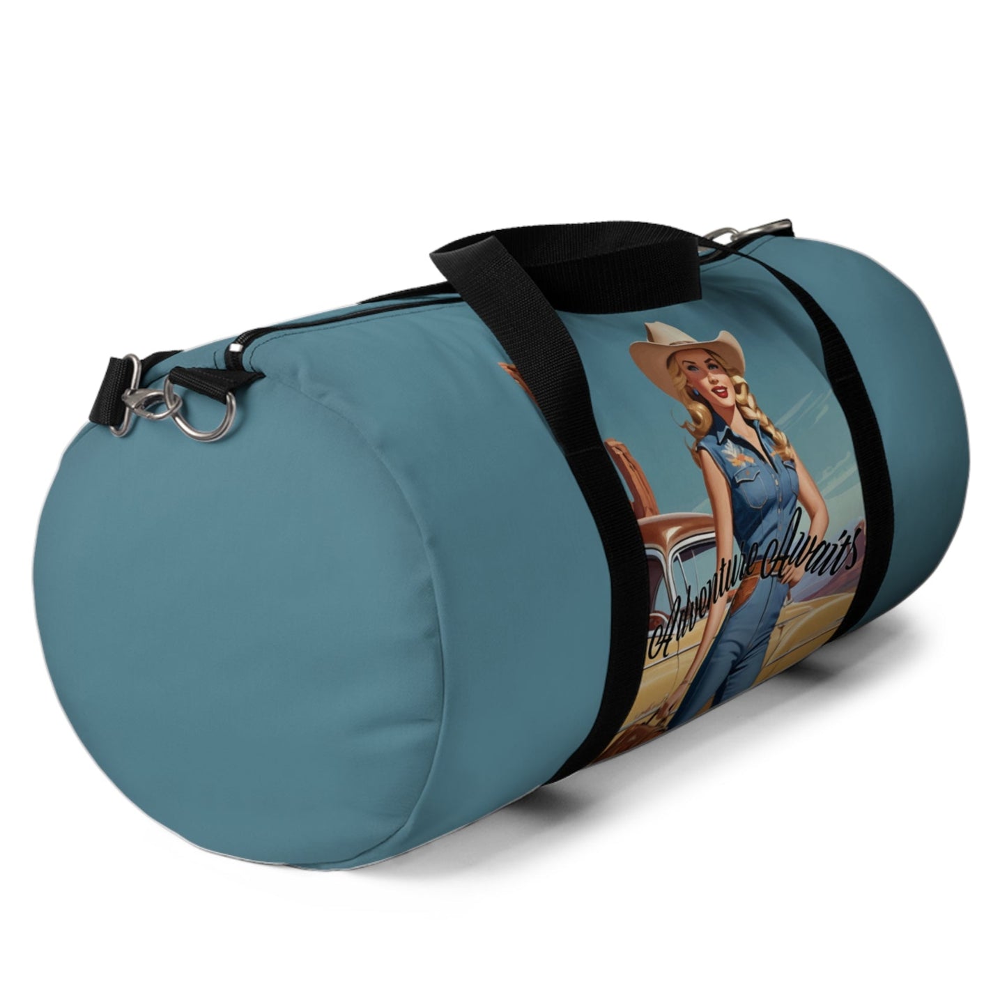LARGE. Robin egg blue duffel bag with colorful retro cowgirl ready to roll through the SW United States. She's got her favorite bag and her trusty vintage sedan. Bag features black handles and a removable shoulder strap as well as a mesh exterior pocket. Available in two sizes.