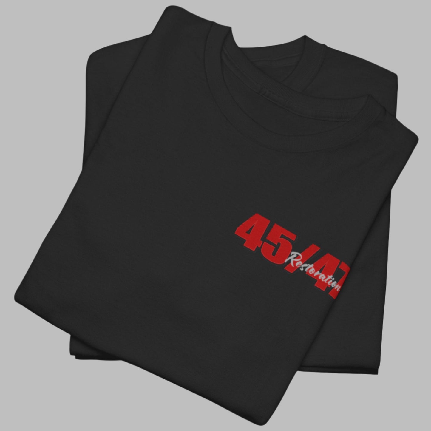Cotton t-shirt imprinted in red with a gray overprint on the back of the names and strongest qualities of President Trump and his cabinet members / nominees. The front is imprinted on the left chest with 45/47 and the word Restoration overprinted in gray.