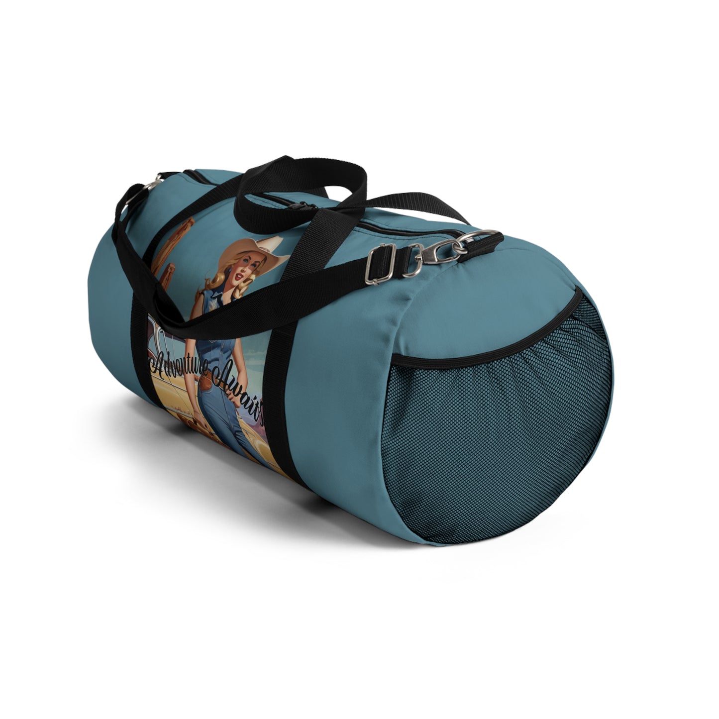 SMALL. Robin egg blue duffel bag with colorful retro cowgirl ready to roll through the SW United States. She's got her favorite bag and her trusty vintage sedan. Bag features black handles and a removable shoulder strap as well as a mesh exterior pocket. Available in two sizes.