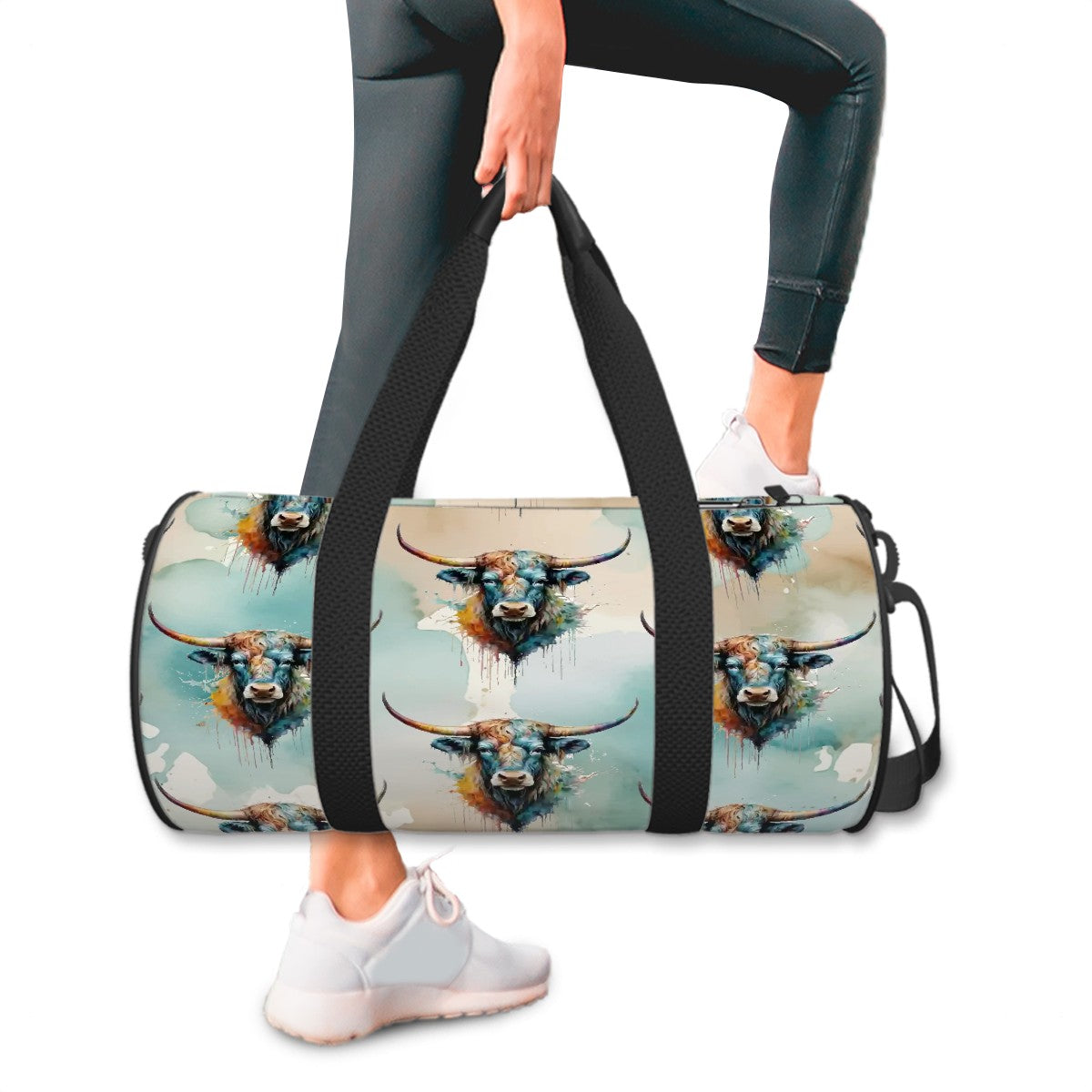 All over watercolor print in shades of turquoise, tan, and white overlaid with our colorful longhorn steer on a water-resistant poly canvas cylinder bag. Black webbing with faux leather grips. Removable nylon shoulder strap. Interior zipper pocket.