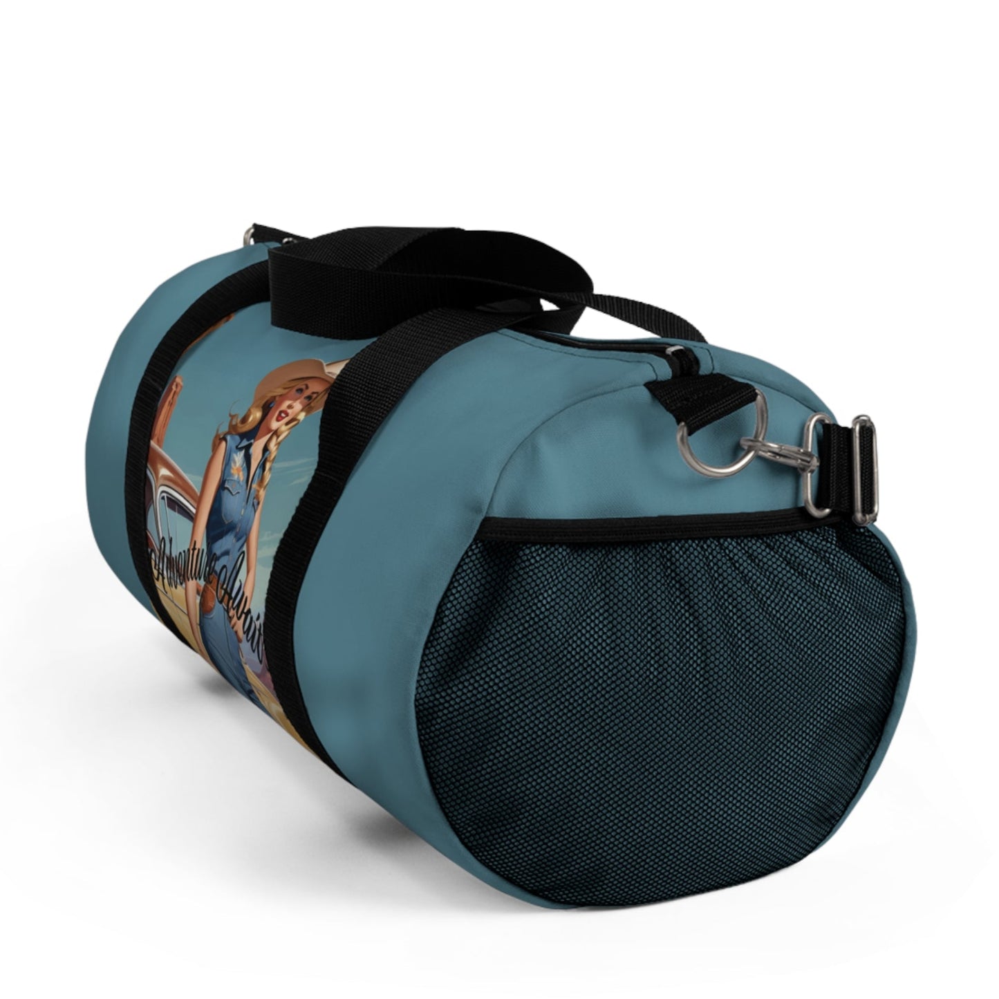 LARGE. Robin egg blue duffel bag with colorful retro cowgirl ready to roll through the SW United States. She's got her favorite bag and her trusty vintage sedan. Bag features black handles and a removable shoulder strap as well as a mesh exterior pocket. Available in two sizes.