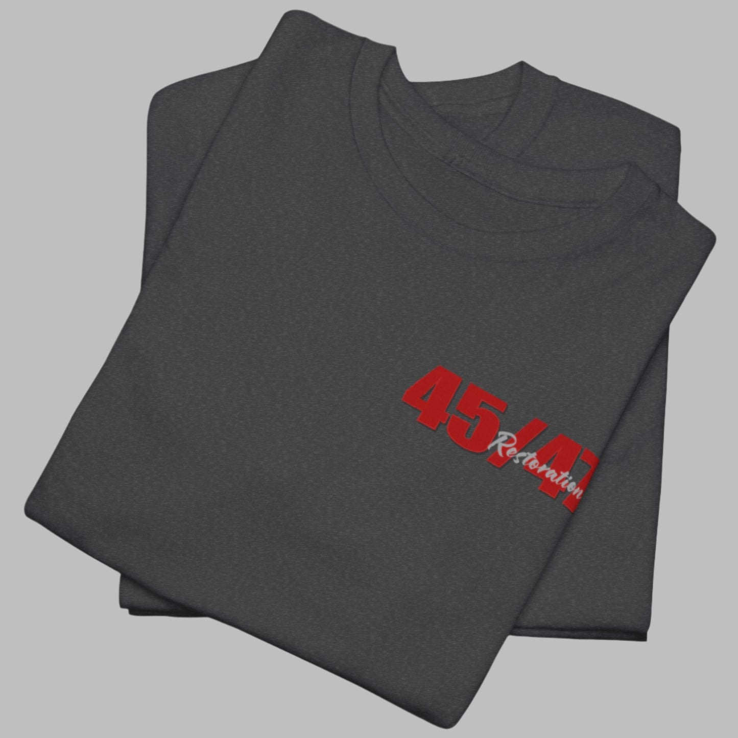 Cotton t-shirt imprinted in red with a gray overprint on the back of the names and strongest qualities of President Trump and his cabinet members / nominees. The front is imprinted on the left chest with 45/47 and the word Restoration overprinted in gray.