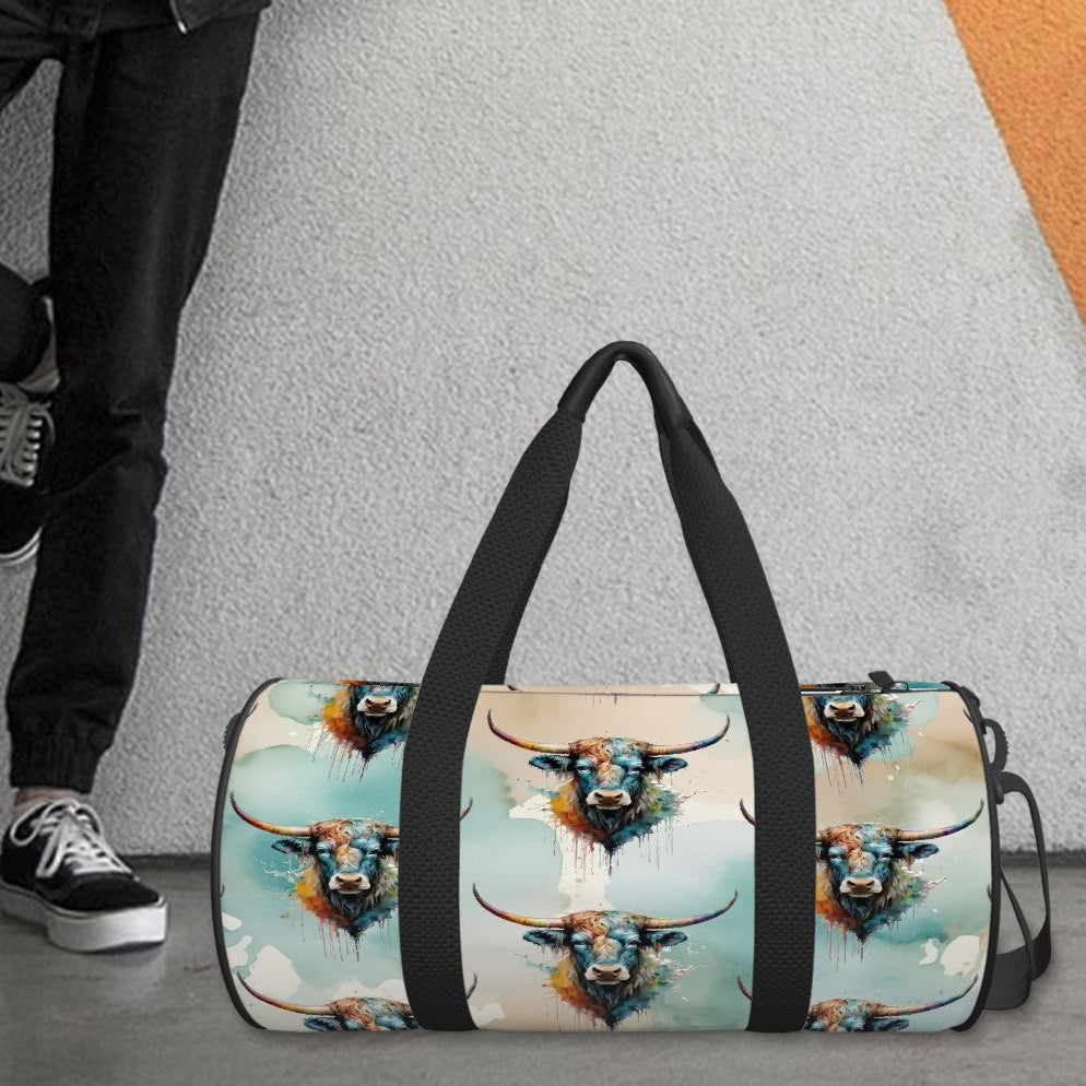 All over watercolor print in shades of turquoise, tan, and white overlaid with our colorful longhorn steer on a water-resistant poly canvas cylinder bag. Black webbing with faux leather grips. Removable nylon shoulder strap. Interior zipper pocket.