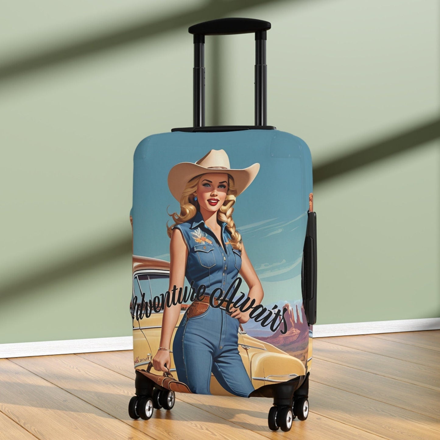 Fun stretch carry on luggage cover features a pretty retro cowgirl in denim standing in front of a vintage car in Monument Valley on a beautiful sunny day with a blue sky. She is wearing a pretty cowboy hat and western belt. Printed both sides.