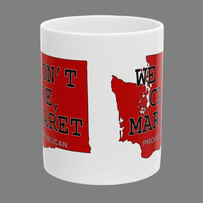 White 11 oz. ceramic coffee mug imprinted on both sides with a red shape of Washington state. Over the top of the image is WE DON'T CARE, MARGARET and Proud Republican. Mug made from an imported base and printed in USA.