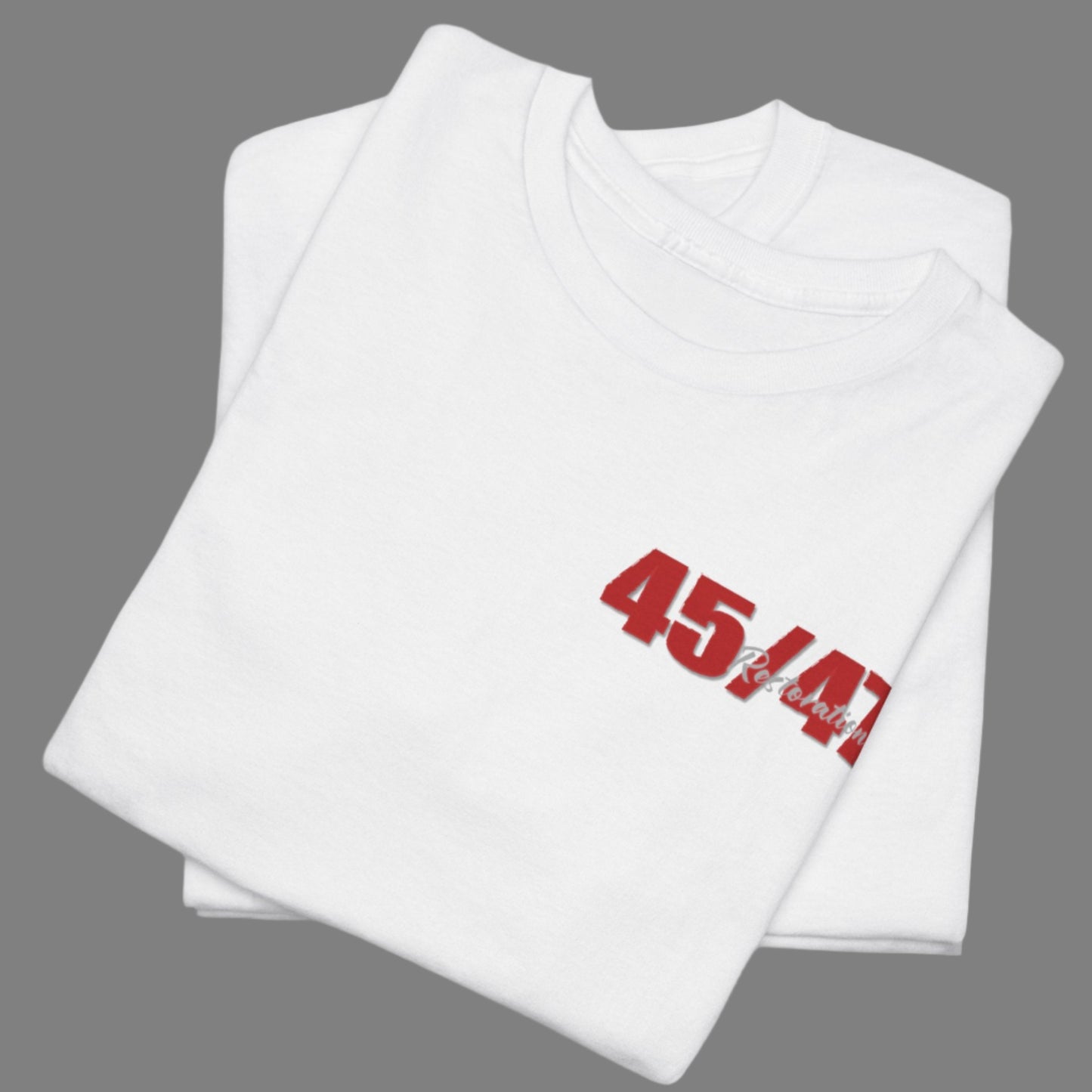 Cotton t-shirt imprinted in red with a gray overprint on the back of the names and strongest qualities of President Trump and his cabinet members / nominees. The front is imprinted on the left chest with 45/47 and the word Restoration overprinted in gray. 