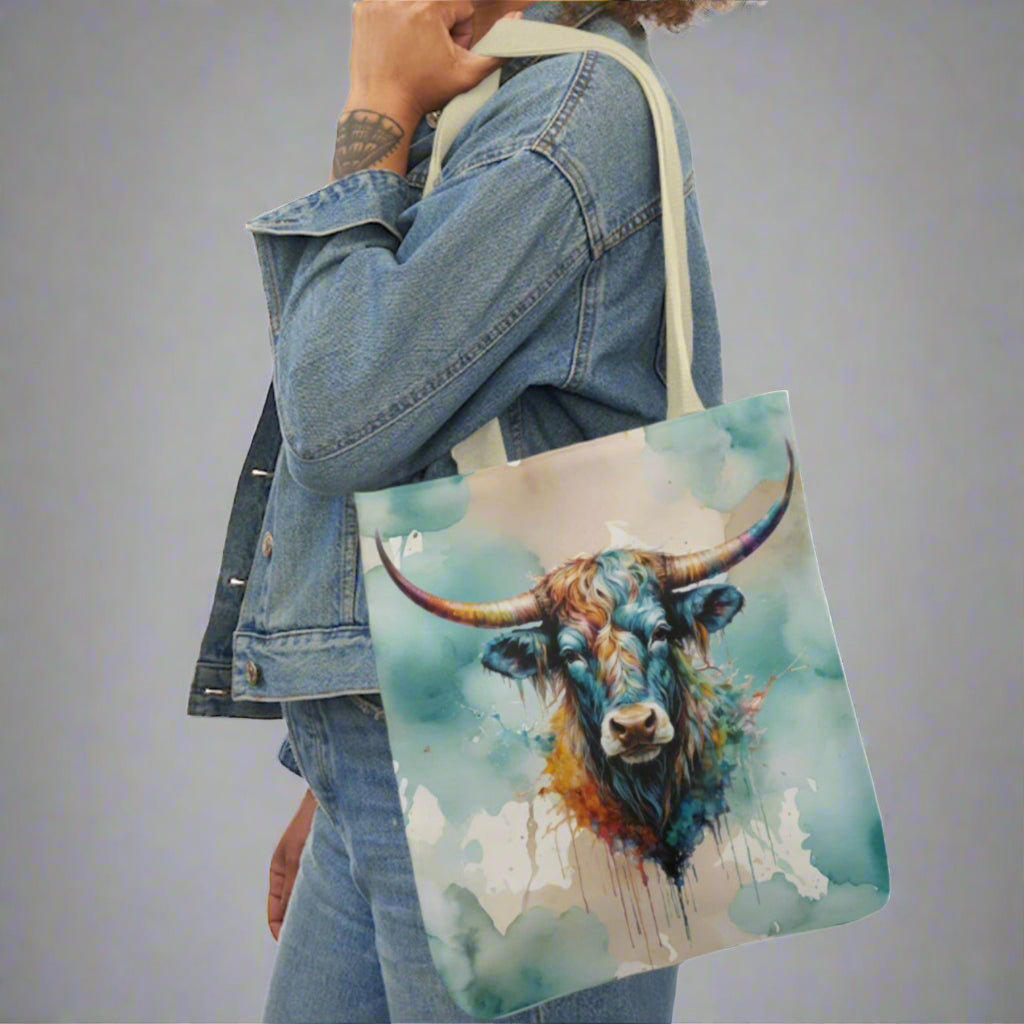 Medium canvas tote with black handles. Imprinted with pretty watercolor background and colorful steer head on both sides. Available in 3 sizes. 