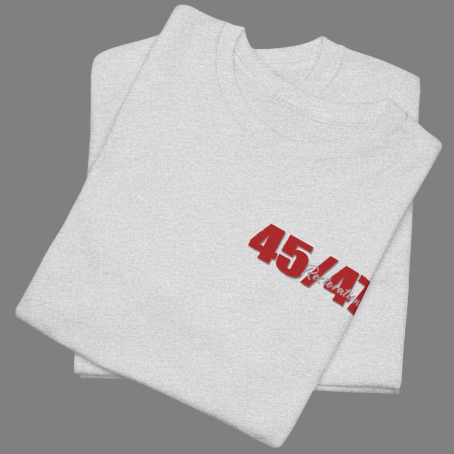 Cotton t-shirt imprinted in red with a gray overprint on the back of the names and strongest qualities of President Trump and his cabinet members / nominees. The front is imprinted on the left chest with 45/47 and the word Restoration overprinted in gray. 