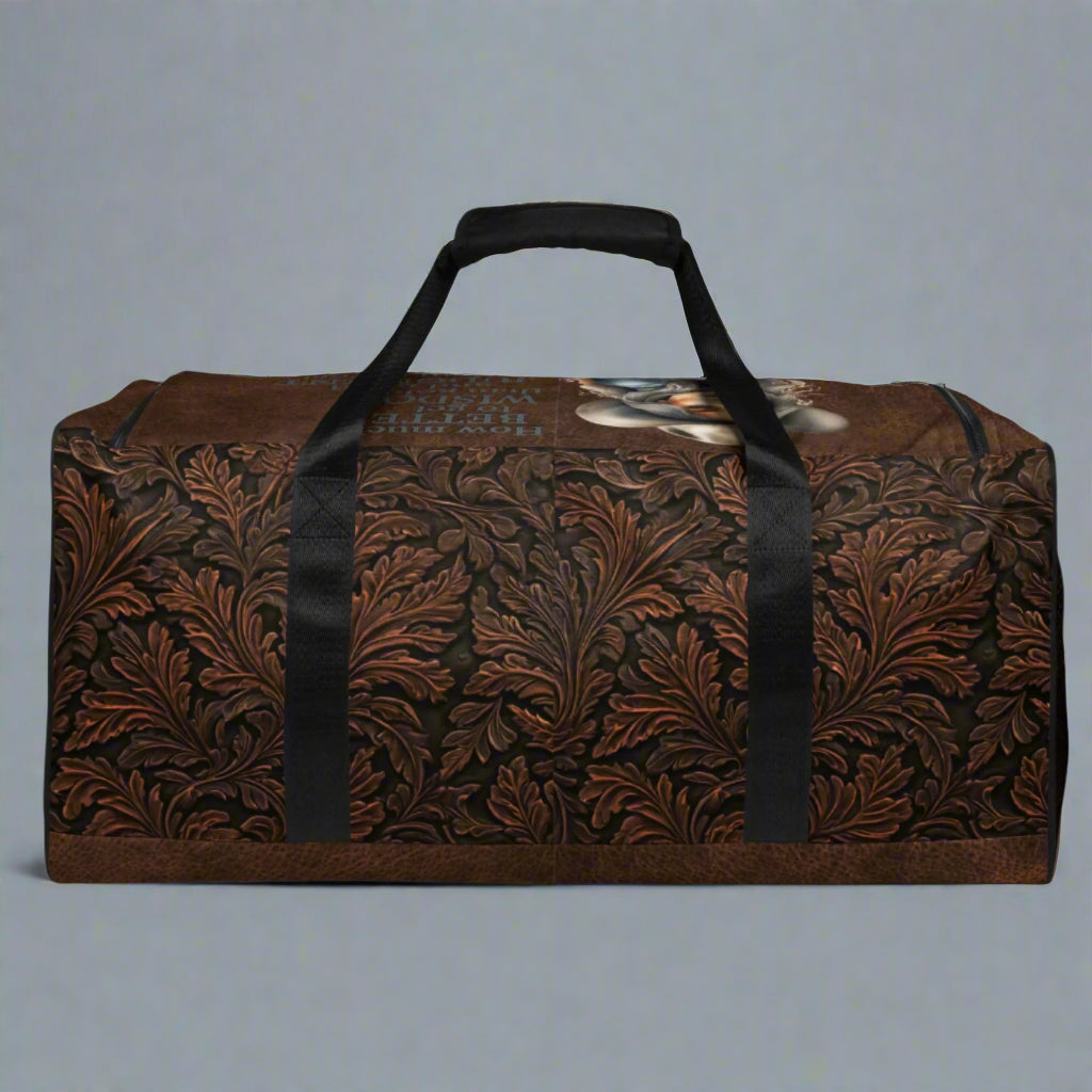 All-over print western tooled leather imprint duffle bag. Black carry straps and handles. Mesh exterior pocket. Imprinted with pretty cowgirl and Proverb about wisdom and good judgment being more valuable that silver and gold. 