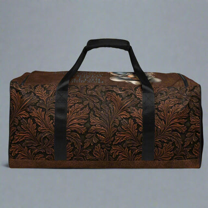 All-over print western tooled leather imprint duffle bag. Black carry straps and handles. Mesh exterior pocket. Imprinted with pretty cowgirl and Proverb about wisdom and good judgment being more valuable that silver and gold. 