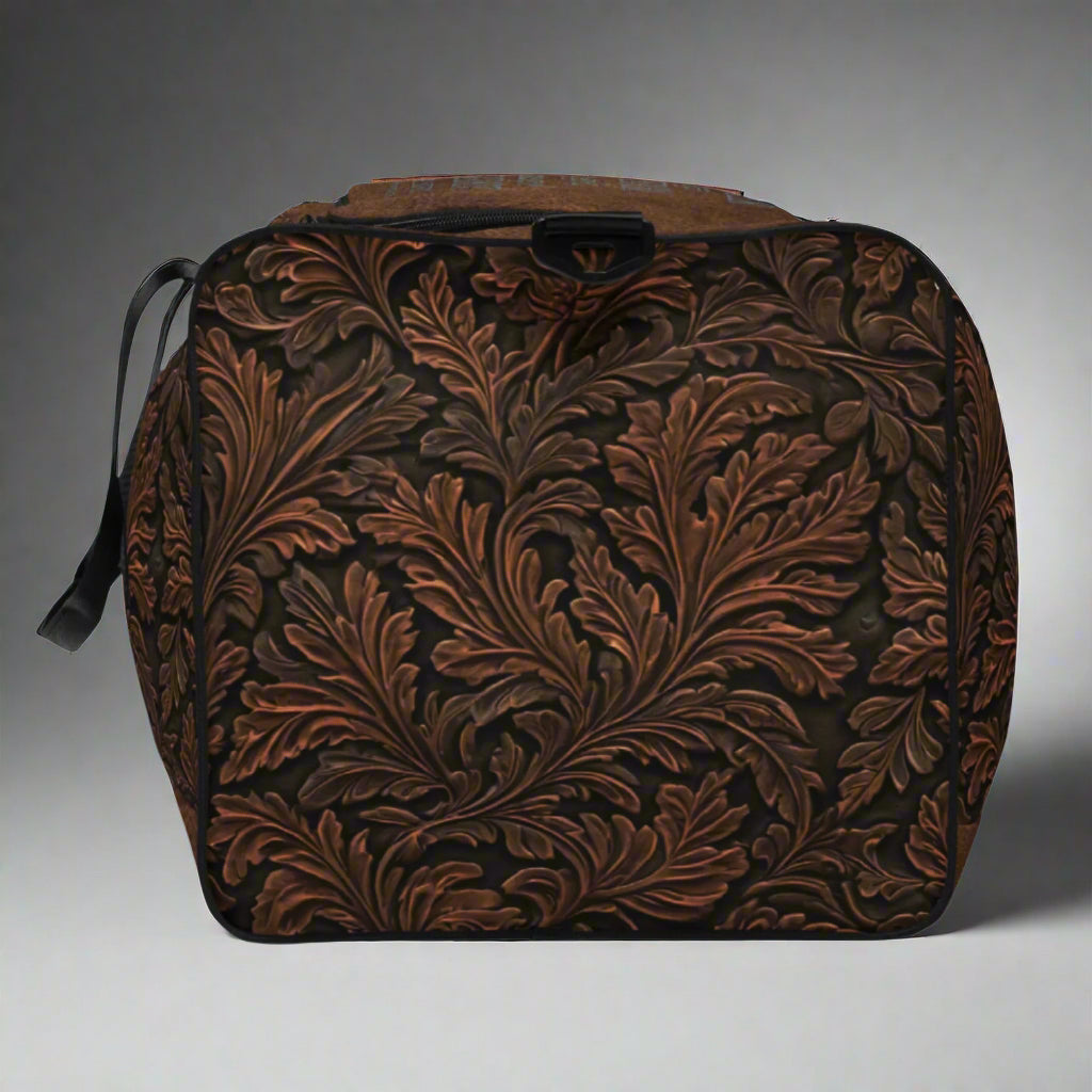 All-over print western tooled leather imprint duffle bag. Black carry straps and handles. Mesh exterior pocket. Imprinted with pretty cowgirl and Proverb about wisdom and good judgment being more valuable that silver and gold. 