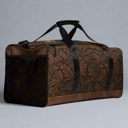 All-over print western tooled leather imprint duffle bag. Black carry straps and handles. Mesh exterior pocket. Imprinted with pretty cowgirl and Proverb about wisdom and good judgment being more valuable that silver and gold. 