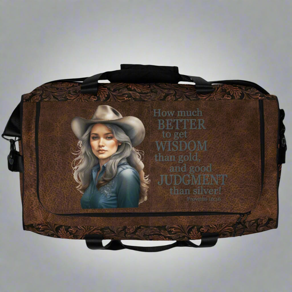 All-over print western tooled leather imprint duffle bag. Black carry straps and handles. Mesh exterior pocket. Imprinted with pretty cowgirl and Proverb about wisdom and good judgment being more valuable that silver and gold. 